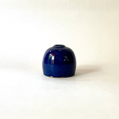 Blue rounded bud vase